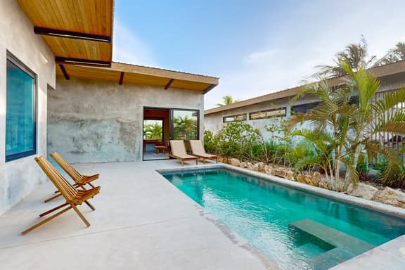 Waterfront villa with pool, spacious deck, dog-friendly & office space