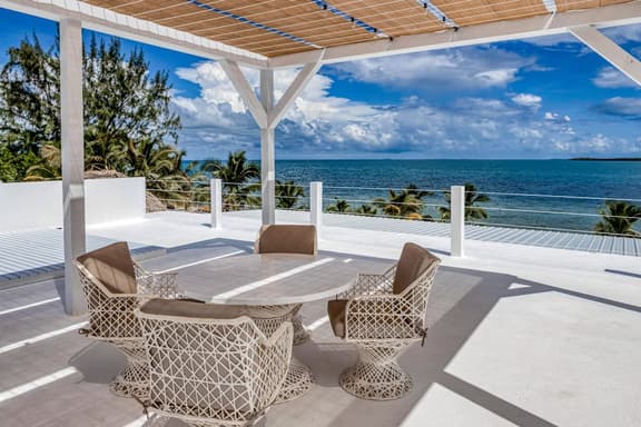 Luxurious beachfront home with private pool, rooftop grill, and sea views