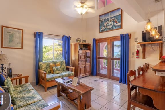 Breezy 2-story oceanfront condo with pool, sea views & partial AC