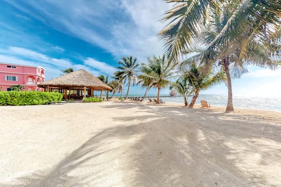 Ocean-view studio with pool, WiFi & partial AC - steps from the beach