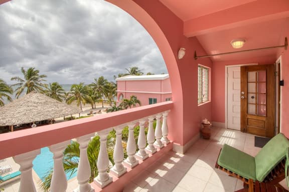 Ocean-view condo with outdoor pool, dock, grill, balcony, beach access