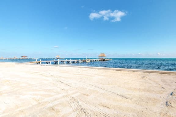 Family-friendly beachfront condo w shared pool & dock, sea view, WiFi & partial AC