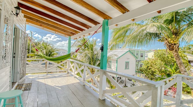 Hammock porch with palm trees, Caye Caulker Belize
