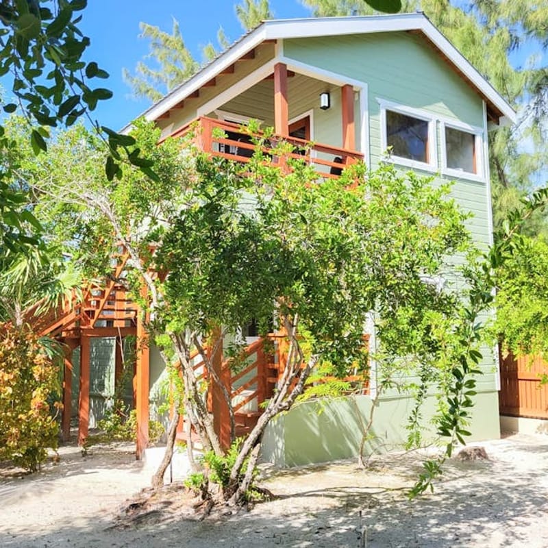 Scenic retreat on the beach with a balcony - pool, grill, dock, and canoe access